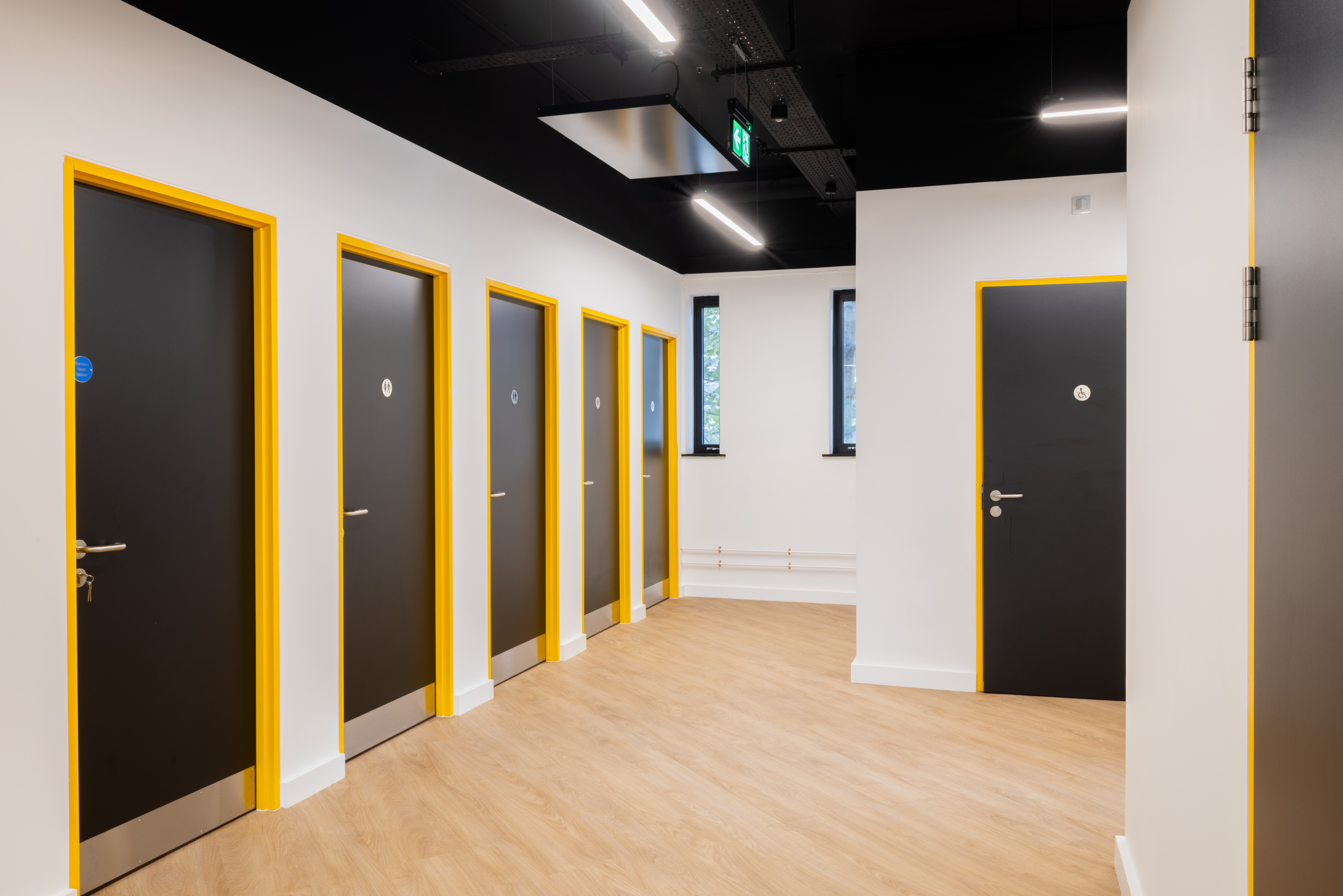 Truline black internal doors with yellow frames at The Business Hive in Grimsby